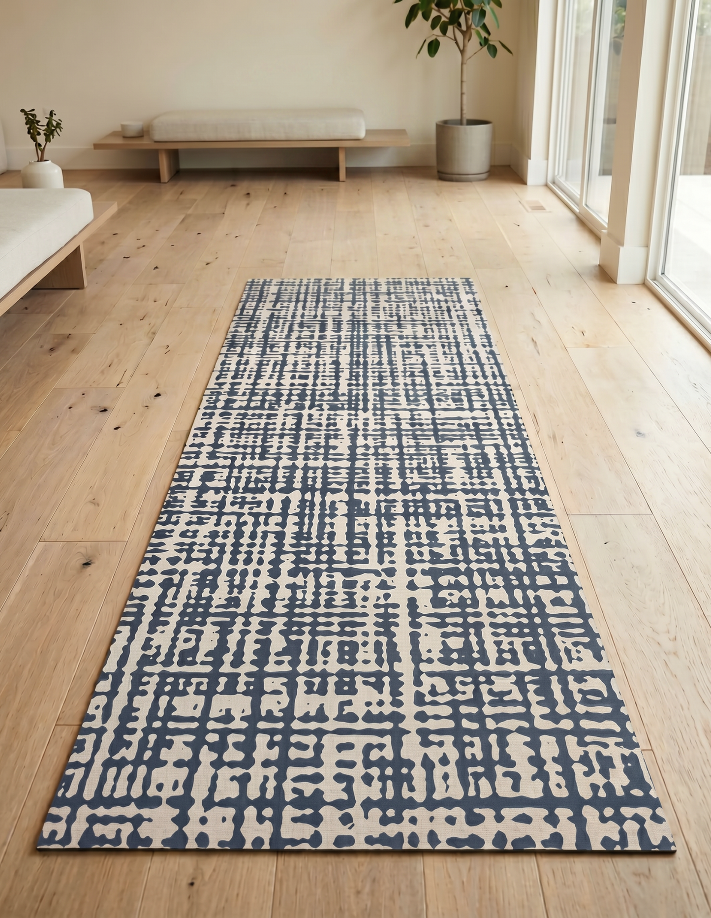 Sloane Midnight studio mat in midnight blue, styled for a home yoga, pilates and HIIT class on cushioned non-toxic foam that rolls up to store