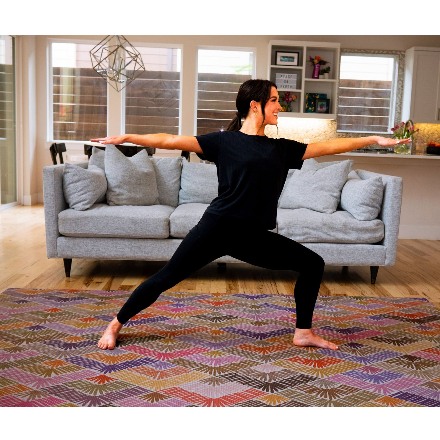 Swankymat non-toxic eco-friendly extra large exercise mat and play mat in Catalina multicolor pink design used for yoga in modern living room