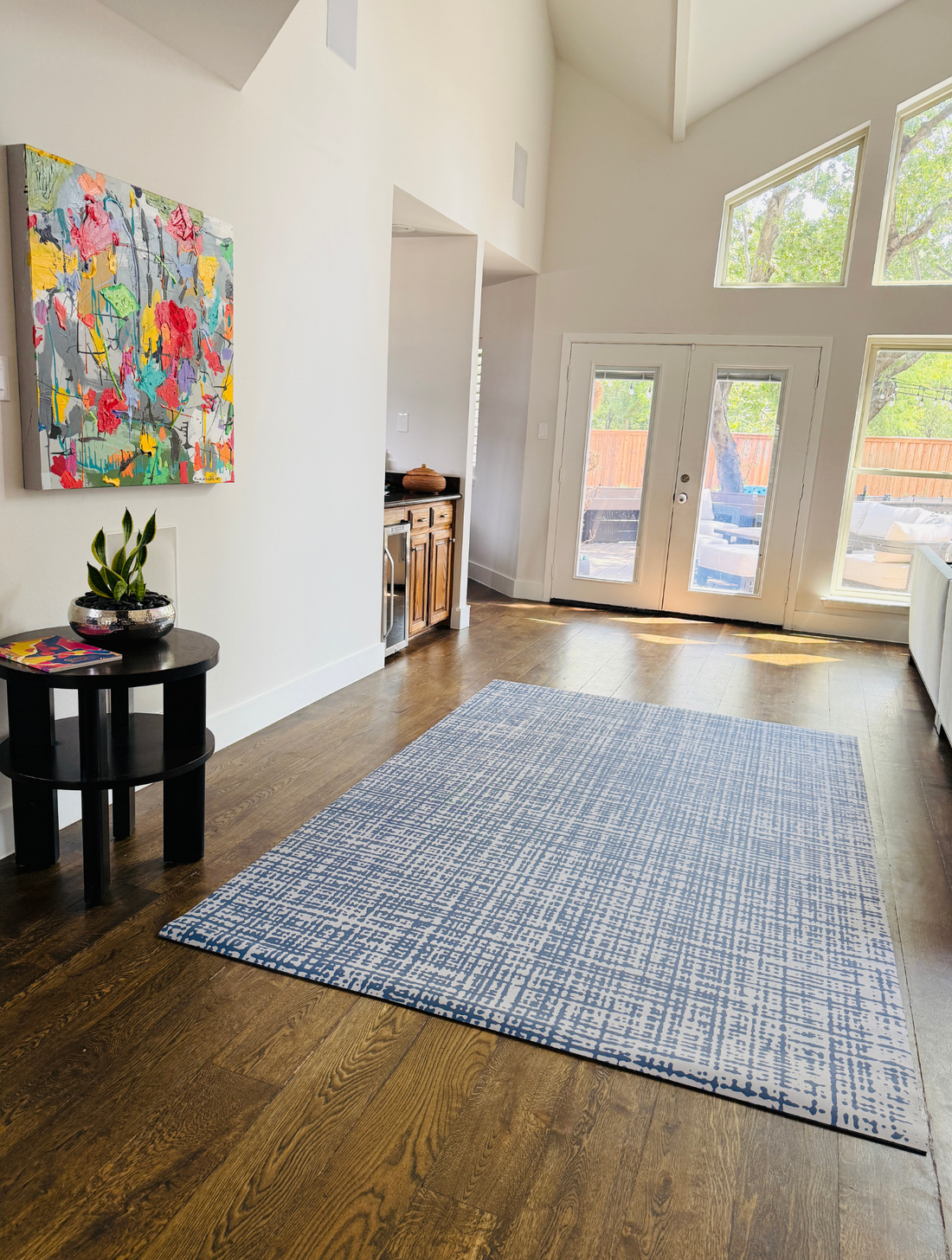 Swankymat 6x9 exercise mat anchoring a modern living room as an area rug alternative