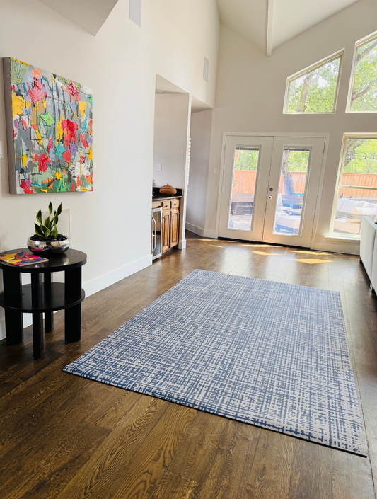 Swankymat 6x9 exercise mat anchoring a modern living room as an area rug alternative