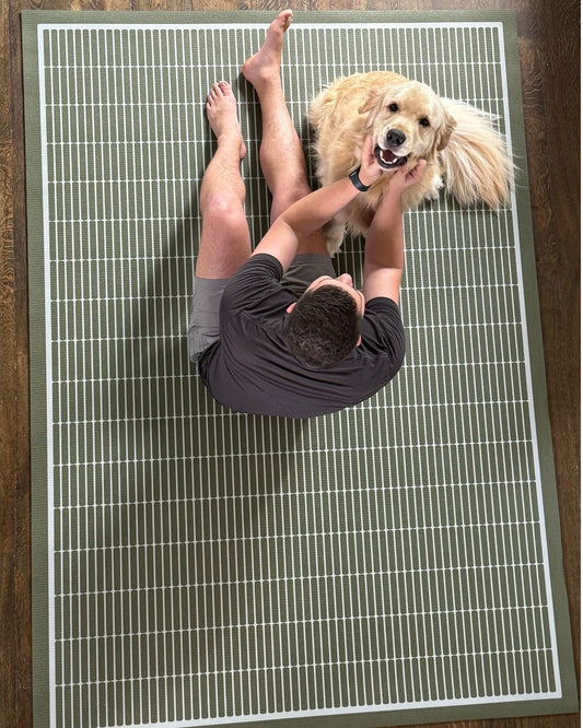 Designer gym equipment featuring the Arlo Olive mat in a curated home gym setup