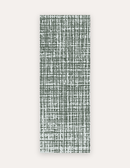 Sloane Forest studio mat in forest-green crosshatch on soft ivory, a non-toxic high-density foam yoga and pilates mat that rolls up to store