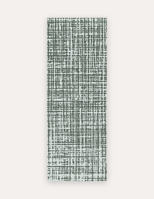 Sloane Forest studio mat in forest-green crosshatch on soft ivory, a non-toxic high-density foam yoga and pilates mat that rolls up to store