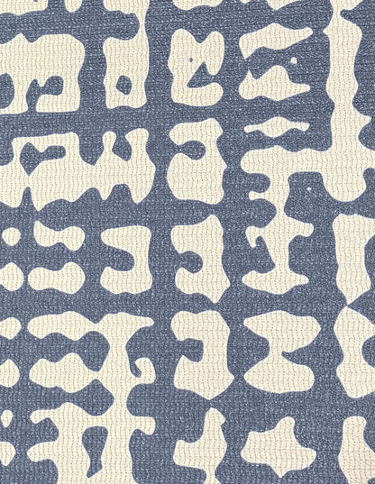 Close-up of the Sloane Midnight mat surface: a hand-drawn midnight-blue crosshatch weave on cushioned, wipe-clean non-toxic foam