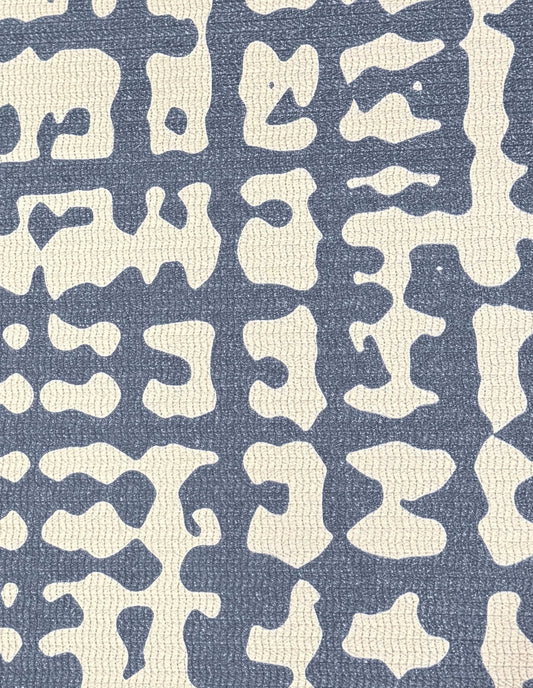 Close-up of the Sloane Midnight mat surface: a hand-drawn midnight-blue crosshatch weave on cushioned, wipe-clean non-toxic foam