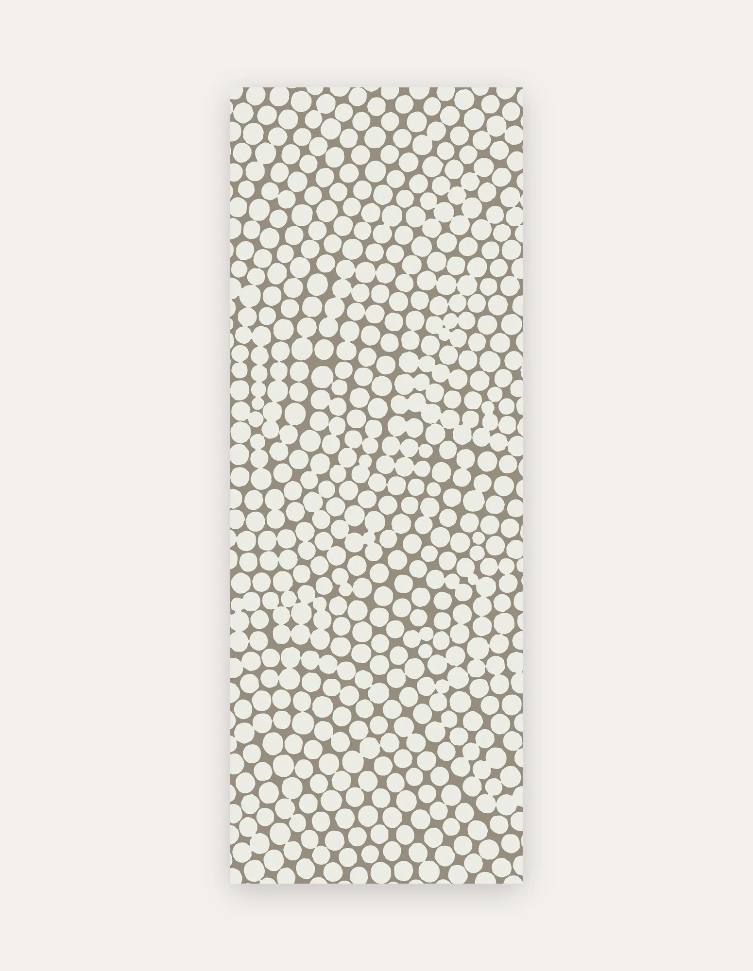 Circa Sandstone Studio Mat, a rollable non-toxic high-density foam studio mat in a warm sandstone pebble-dot design, shown flat for yoga, pilates and HIIT