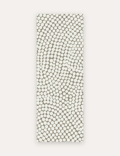 Circa Sandstone Studio Mat, a rollable non-toxic high-density foam studio mat in a warm sandstone pebble-dot design, shown flat for yoga, pilates and HIIT