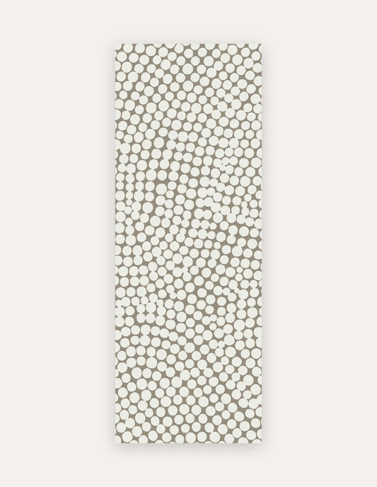 Circa Sandstone Studio Mat, a rollable non-toxic high-density foam studio mat in a warm sandstone pebble-dot design, shown flat for yoga, pilates and HIIT