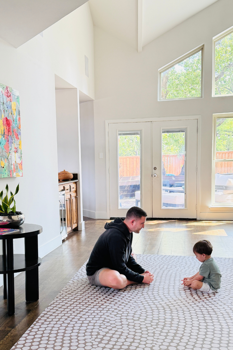 Dad and son playing together on Swankymat in living room