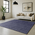Swankymat navy textured design exercise mat and play mat in modern living room with beige sofa, black pendant light, and art.
