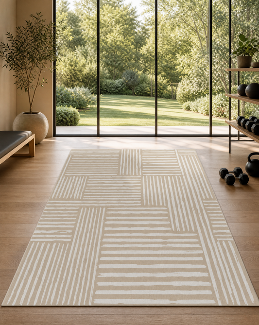 Rhodes Camel extra-large mat in warm camel tan styled in a neutral home gym, showing the 6x9 ft non-toxic foam as a stylish workout and play space