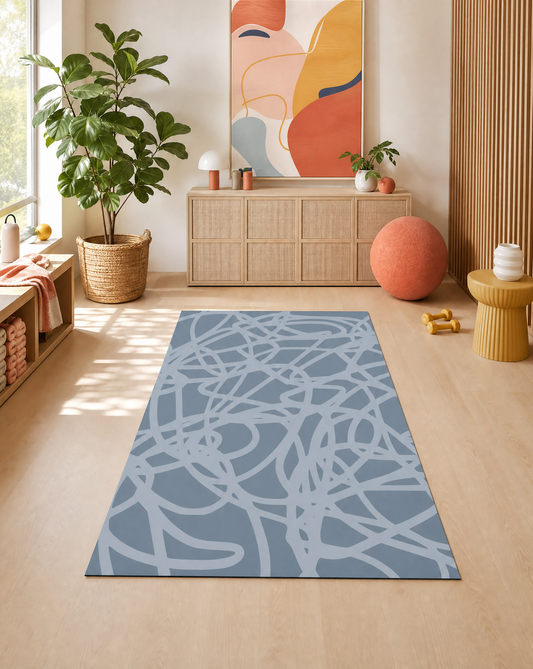 Scribble Hazy extra-large mat in hazy-blue scribble styled in a bright home gym, its 6x9 ft non-toxic foam doubling as a workout and play space