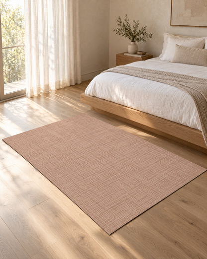 Sloane Blush Oversized Mat at the foot of a bed in a serene bedroom, a soft blush non-toxic extra large exercise mat