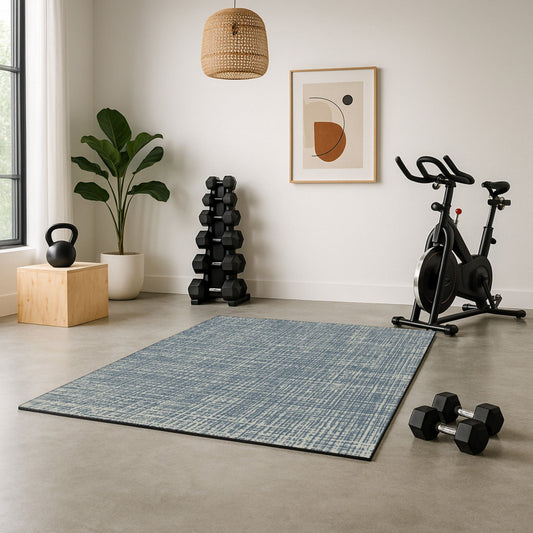 Home gym with exercise equipment on a blue decorative exercise mat and play mat for babies and kids.