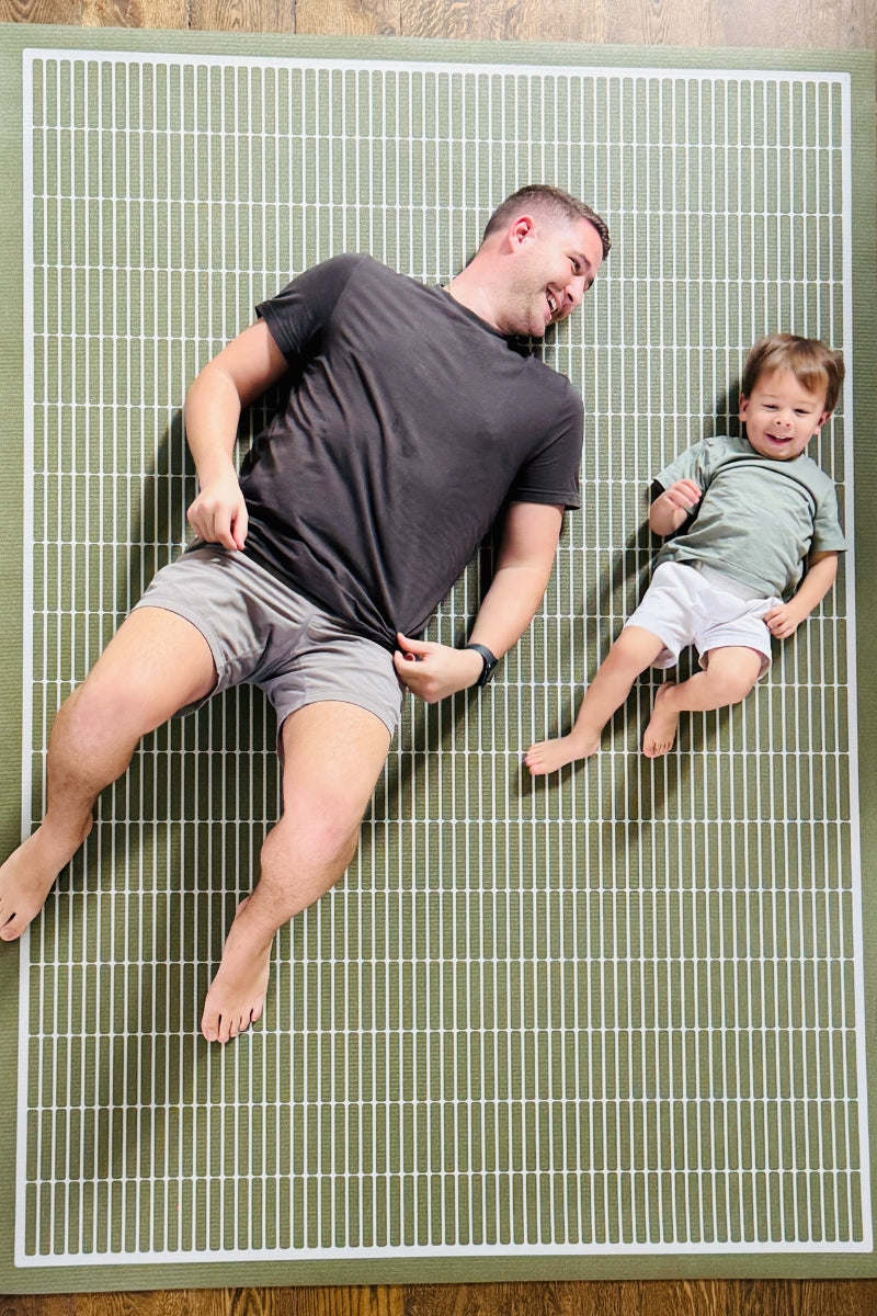 Man and child exercising on Swankymat non toxic large yoga mat in modern green neutral pattern