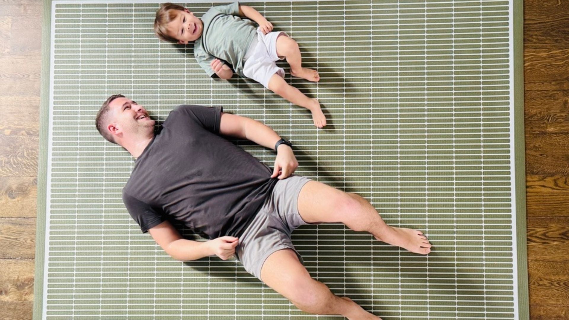 Man and child exercising on Swankymat non toxic large yoga mat in modern green neutral pattern