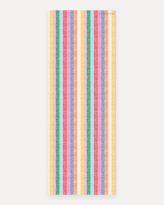 Swankymat The Riviera Mat non-toxic foam studio yoga and exercise mat, 26 by 71 inch studio size, bright multicolor woven cabana stripe pattern in yellow, green, aqua, coral, pink, blue, and orange shown flat from above